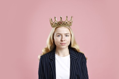 Photo of Businesswoman in elegant crown on dusty pink background