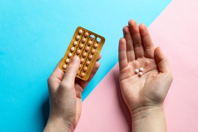 Photo of Woman with contraceptive pills on color background, closeup