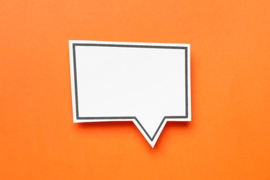 Photo of Blank speech bubble on orange background, top view. Space for text