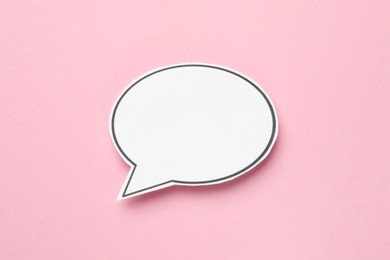 Photo of Blank speech bubble on light pink background. Space for text