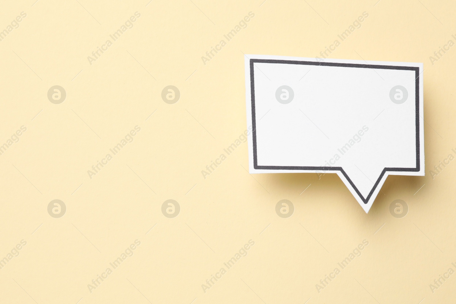 Photo of Blank speech bubble on beige background, top view. Space for text