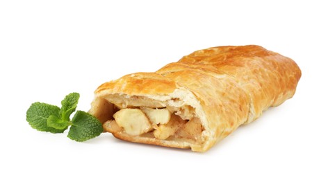 Photo of Delicious strudel with apples, powdered sugar and mint isolated on white