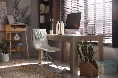 Photo of Comfortable workplace with computer in home office