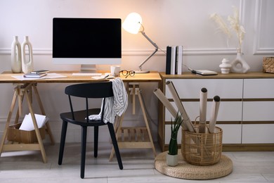 Photo of Comfortable workplace with computer in home office