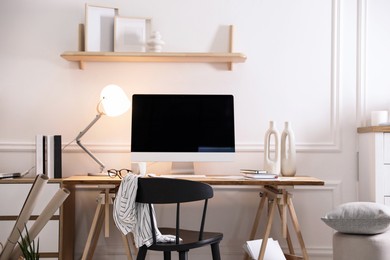 Comfortable workplace with computer in home office