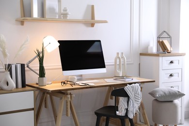 Comfortable workplace with computer in home office