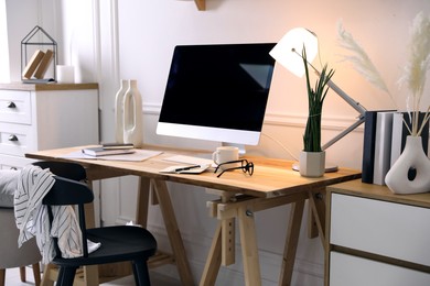 Comfortable workplace with computer in home office