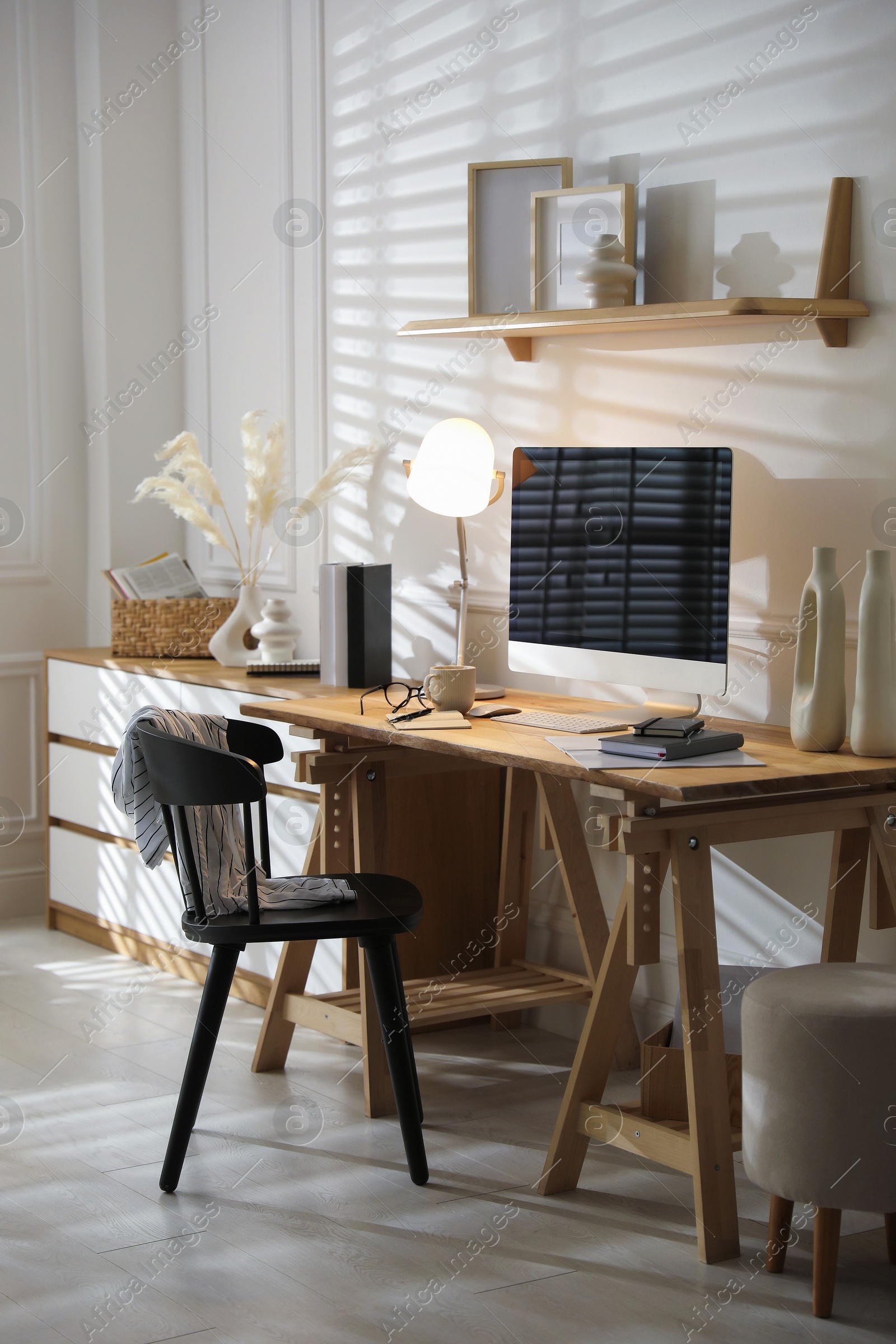 Photo of Comfortable workplace with computer in home office