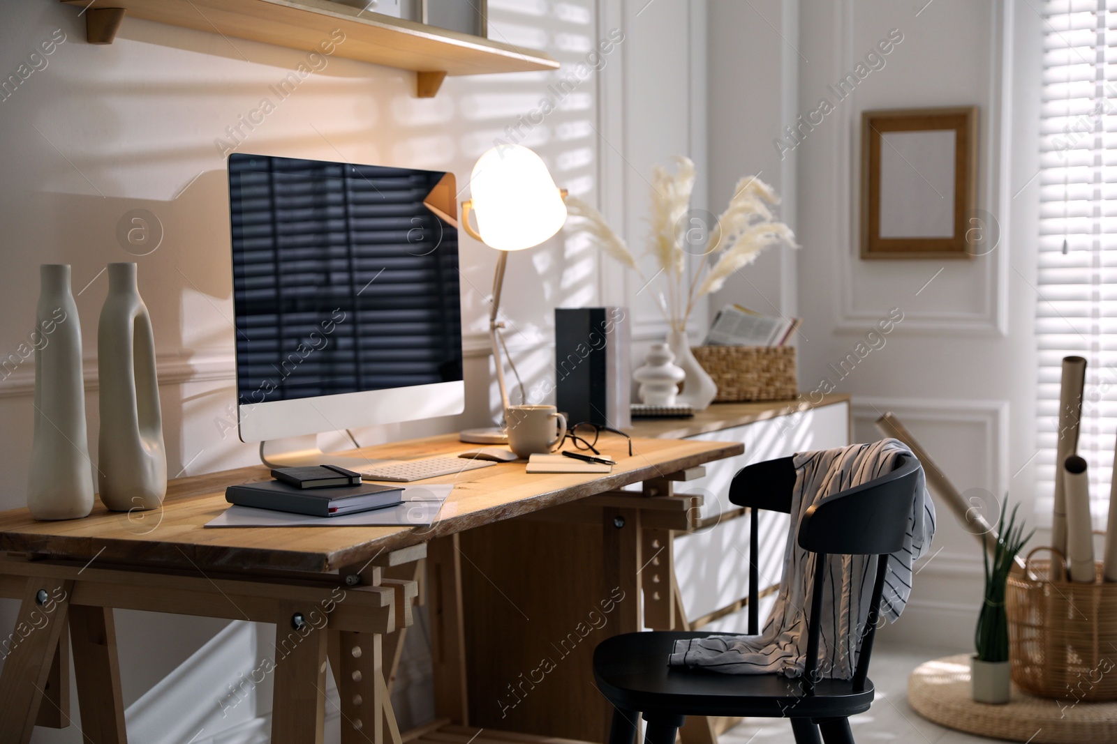 Photo of Comfortable workplace with computer in home office