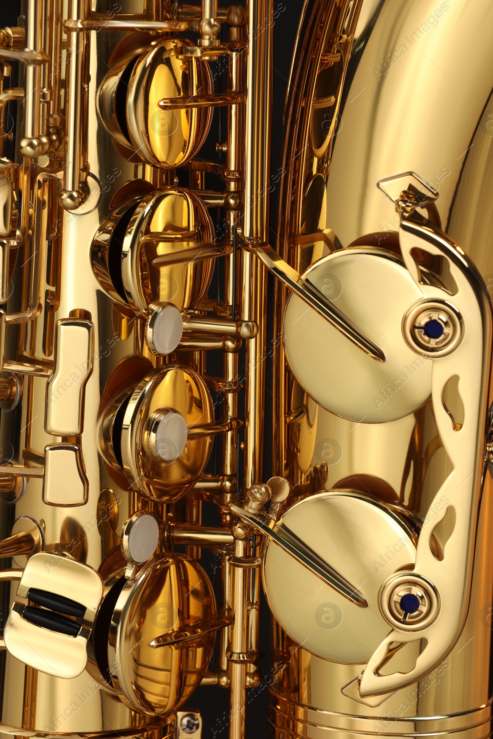 Photo of Jazz. Beautiful golden saxophone as background, closeup