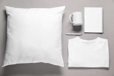 Photo of Different blank items for branding on grey background, flat lay. Mockup for design