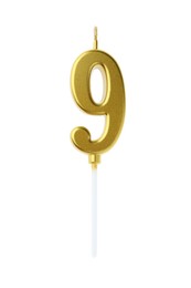 Photo of Golden birthday candle in shape of number 9 isolated on white