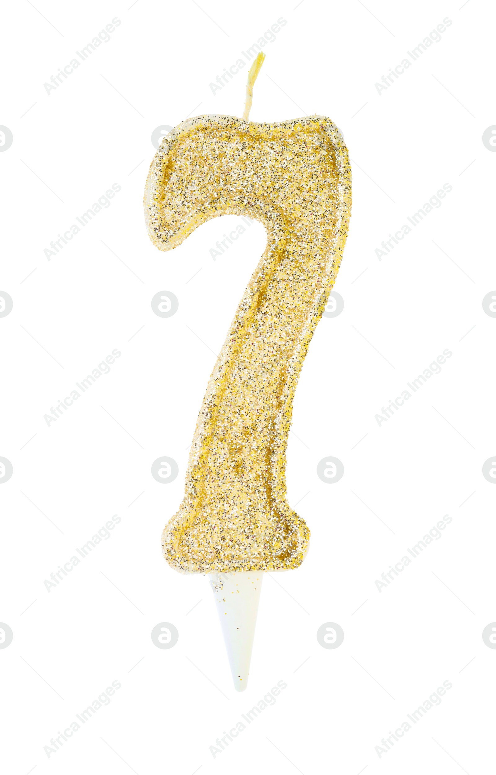 Photo of Golden birthday candle in shape of number 7 isolated on white