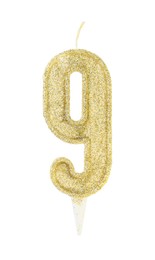 Photo of Golden birthday candle in shape of number 9 isolated on white