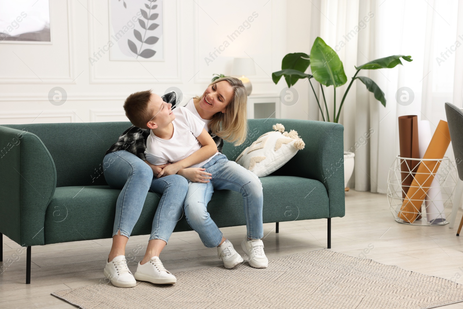 Photo of Mother and son having fun at home