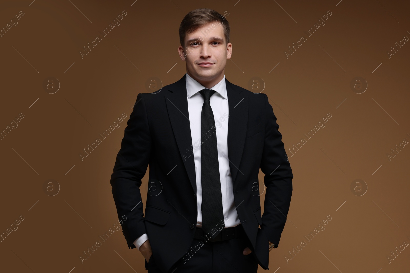 Photo of Man in classic suit on brown background