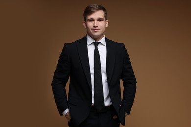 Man in classic suit on brown background