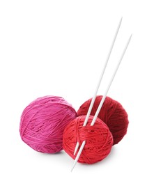 Balls of colorful yarns and knitting needles isolated on white