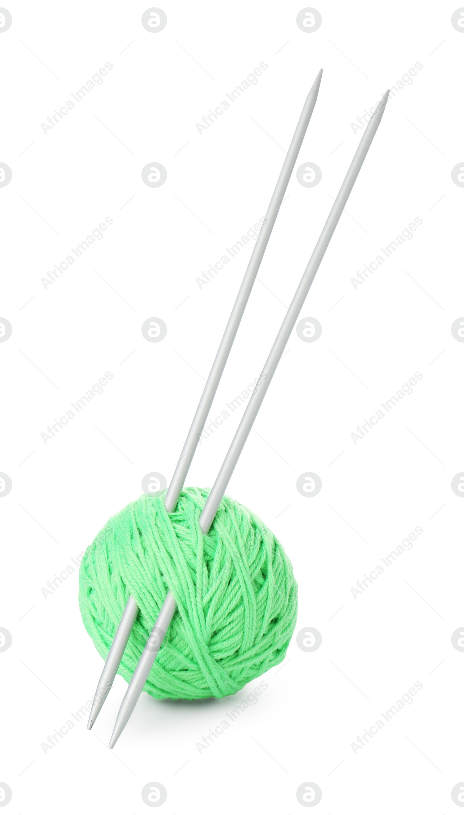 Photo of Ball of light green yarn and knitting needles isolated on white