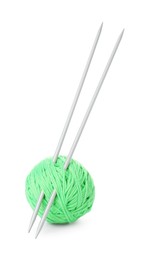 Photo of Ball of light green yarn and knitting needles isolated on white