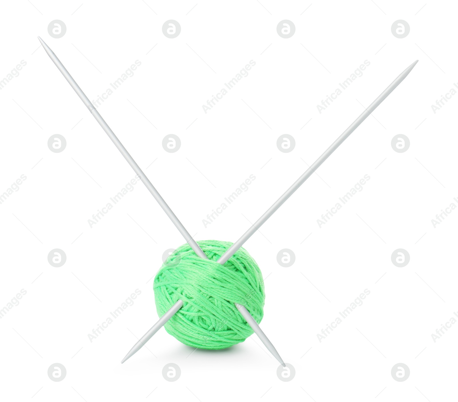 Photo of Ball of light green yarn and knitting needles isolated on white