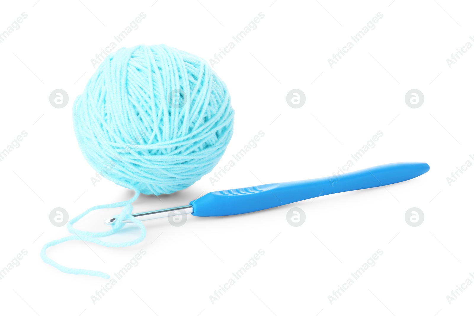 Photo of Ball of light blue yarn and crochet hook isolated on white