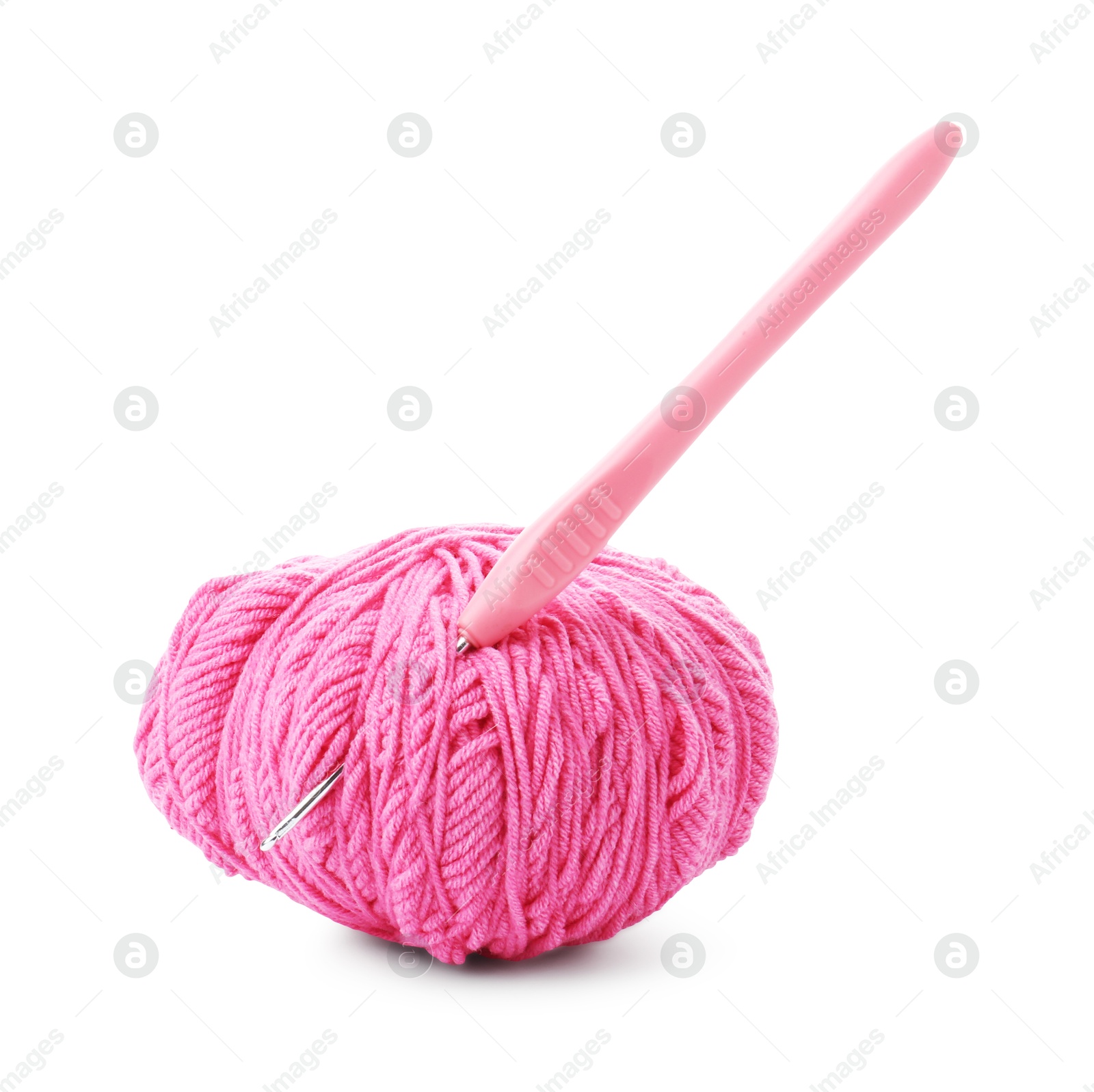 Photo of Ball of pink yarn and hook isolated on white