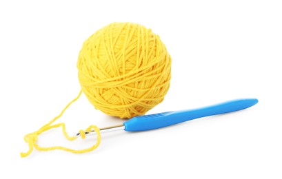 Photo of Ball of yellow yarn and hook isolated on white