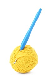 Photo of Ball of yellow yarn and hook isolated on white