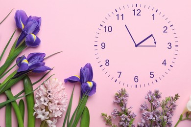 Image of Clock and flowers on pink background, top view. Arrow showing time change one hour ahead in spring. Daylight saving time