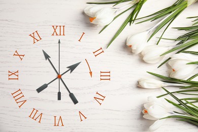 Image of Clock and flowers on white wooden background, top view. Arrow showing time change one hour ahead in spring. Daylight saving time