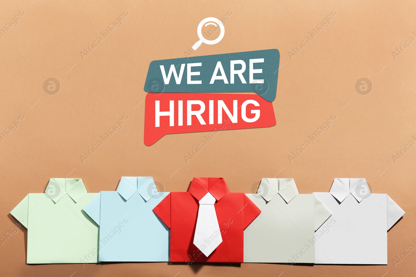 Image of We Are Hiring announcement. Paper shirts on pale brown background, top view. Human resource