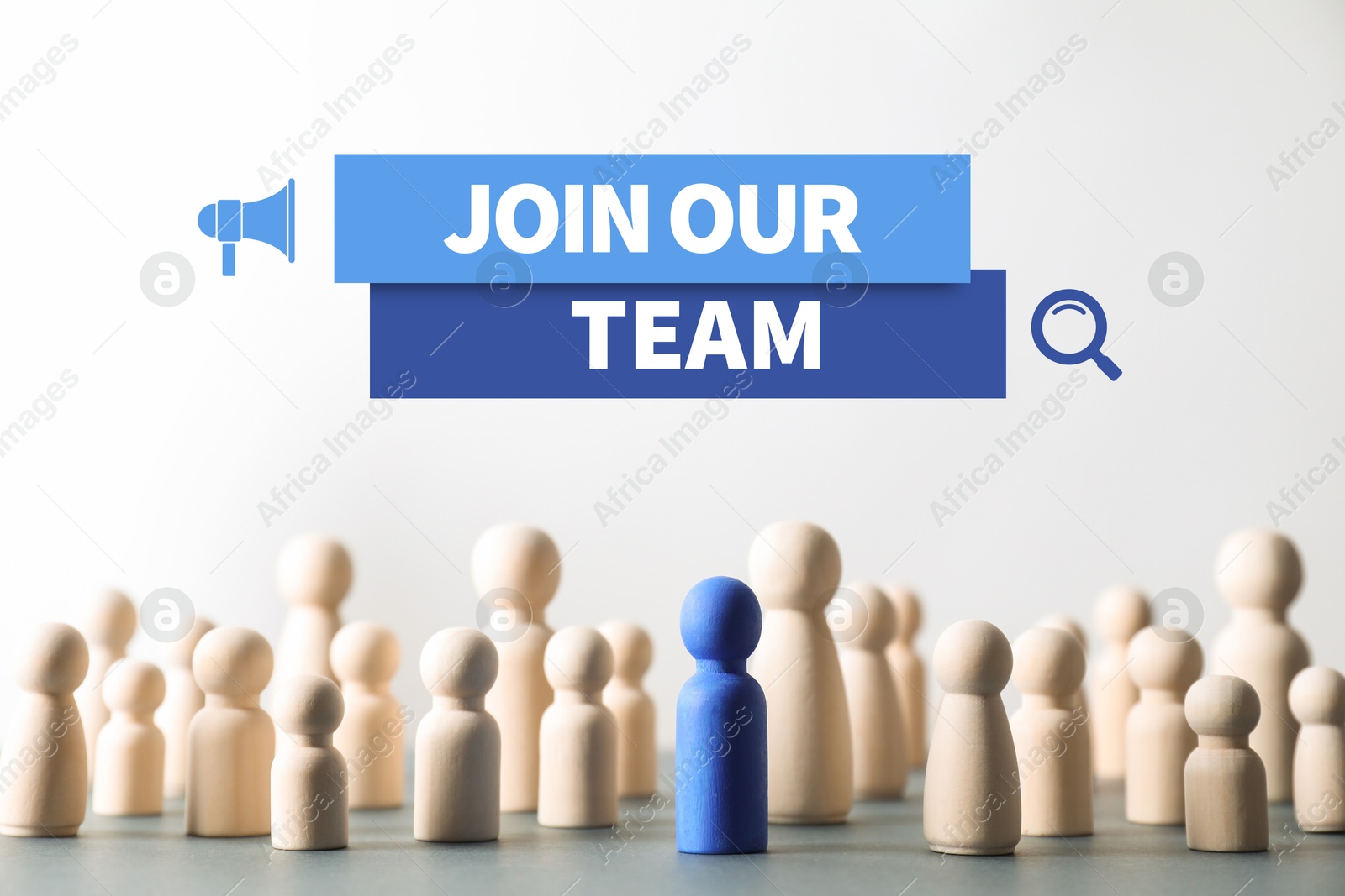 Image of Join Our Team announcement. Blue figure among wooden ones on table. Human resource