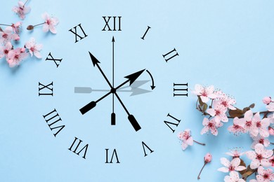 Image of Clock and flowers on light blue background, top view. Arrow showing time change one hour ahead in spring. Daylight saving time