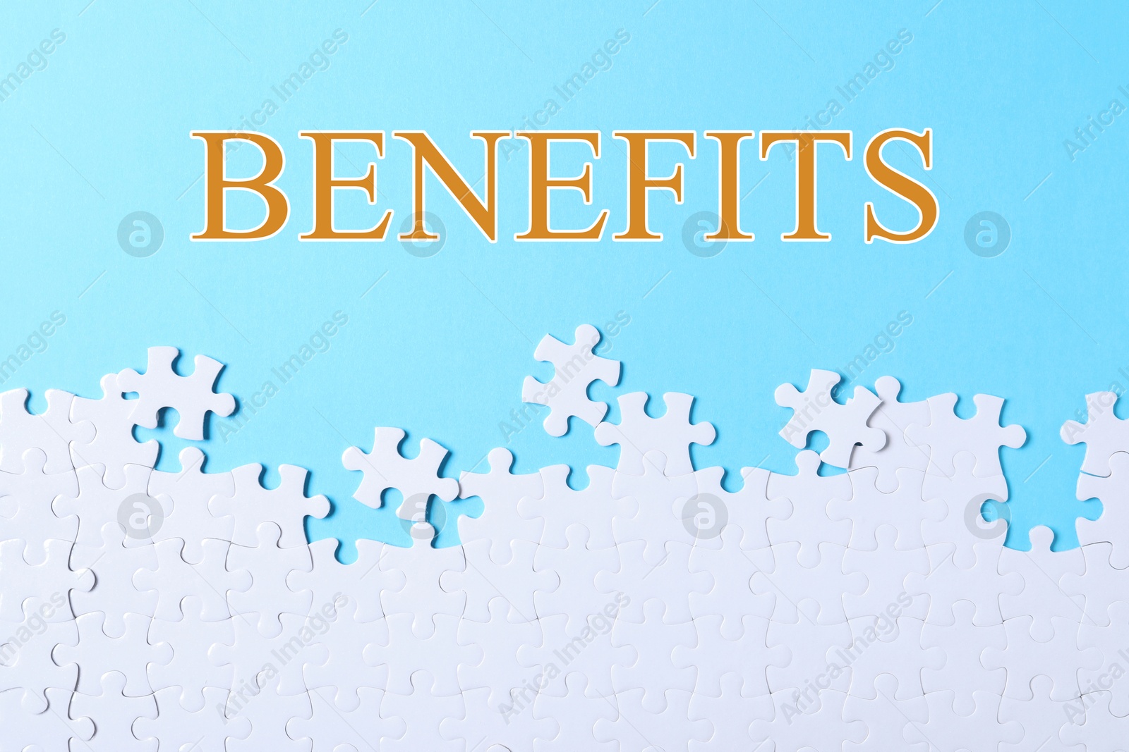 Image of Benefits word and white jigsaw puzzle pieces on light blue background, top view