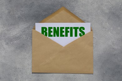 Image of Letter with Benefits word and envelope on grey table, top view