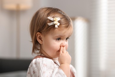 Photo of Portrait of cute little baby girl at home