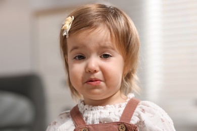 Photo of Cute little baby girl crying at home