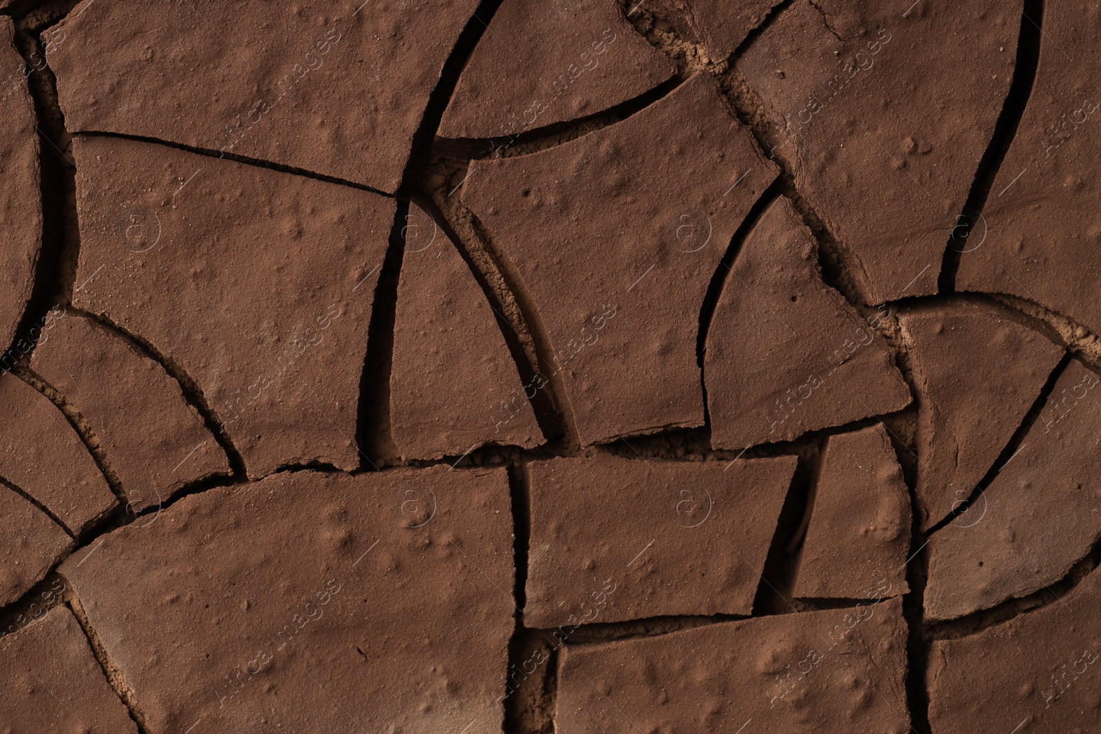 Photo of Dry cracked ground as background, closeup. Global warming