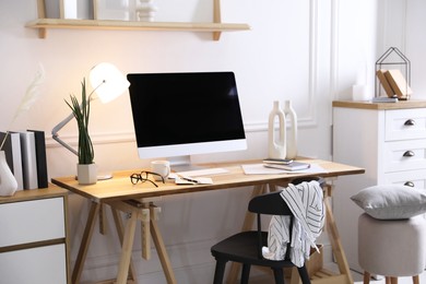 Comfortable workplace with computer in home office