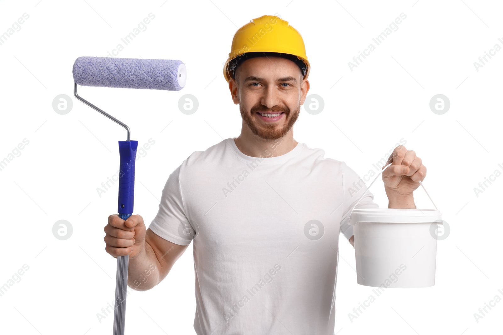 Photo of Man wearing hardhat with roller and bucket of paint on white background