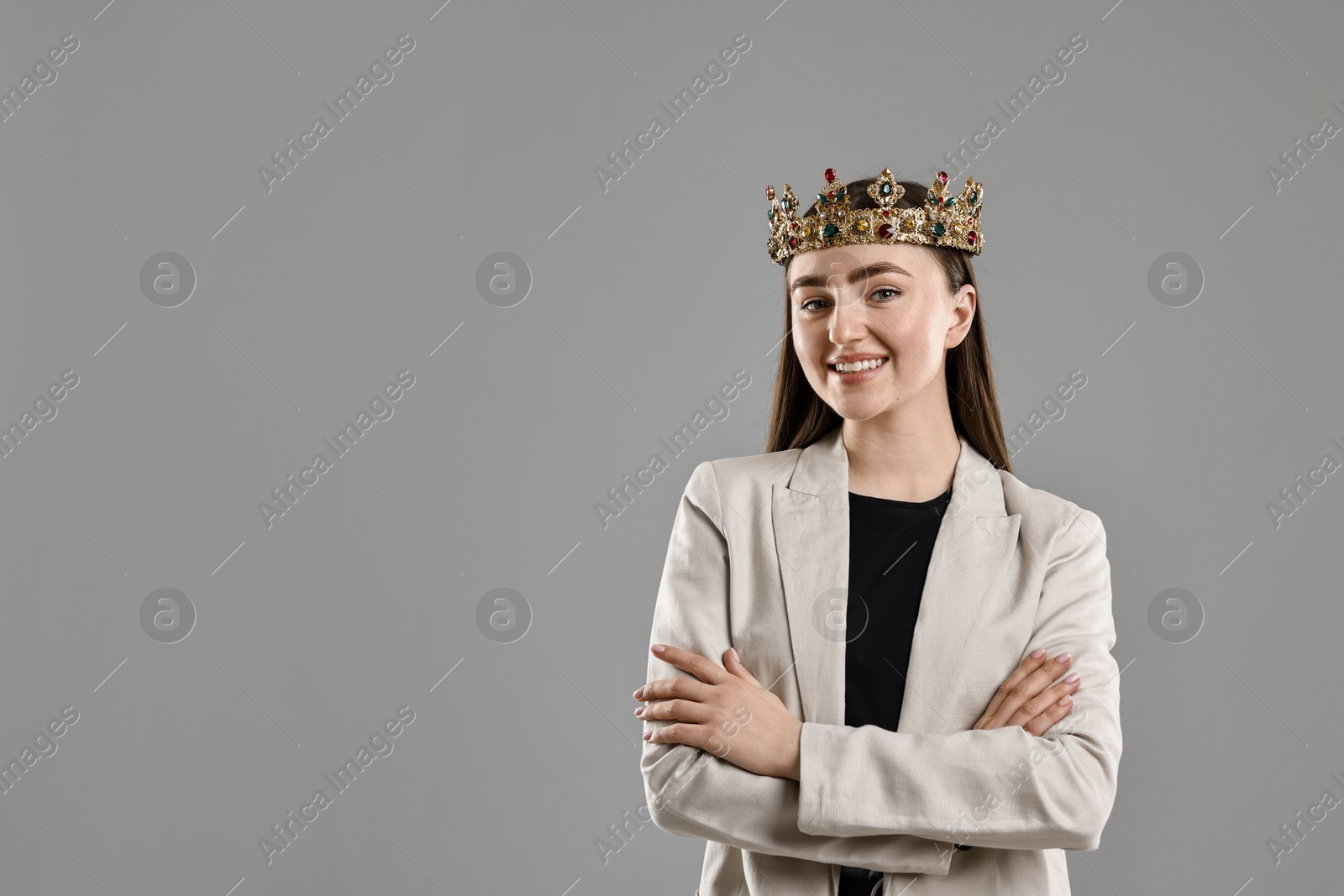 Photo of Happy businesswoman in elegant crown on grey background. Space for text