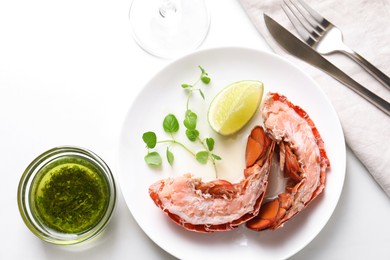 Photo of Delicious boiled lobster served on white table, flat lay