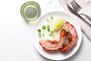 Delicious boiled lobster served on white table, flat lay