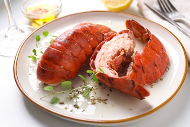 Delicious tails of boiled lobsters served on white table, closeup