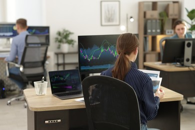 Photo of Stock exchange. Business team working in office, selective focus