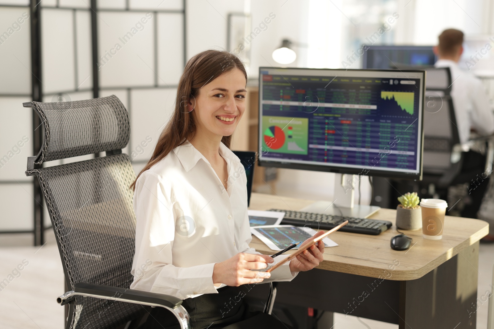 Photo of Stock exchange. Woman working at desk in office