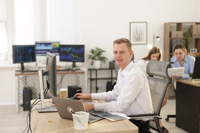 Stock exchange. Man working at desk in office