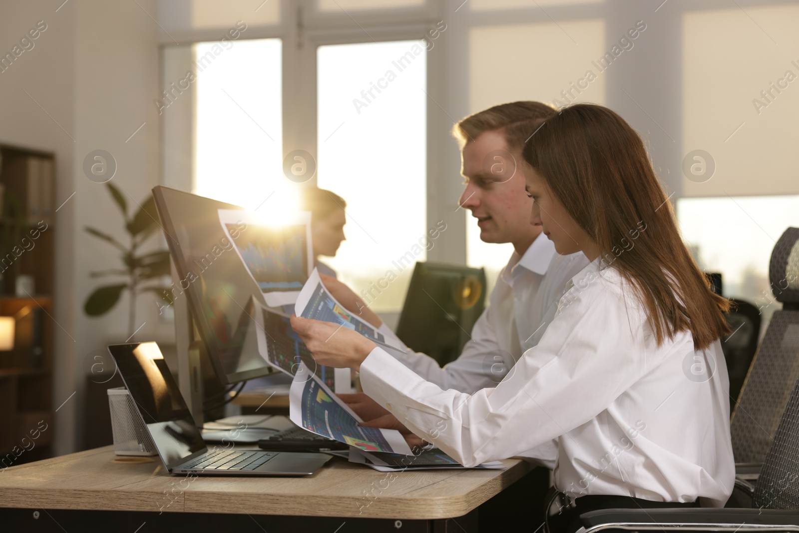 Photo of Stock exchange. Colleagues working together in office