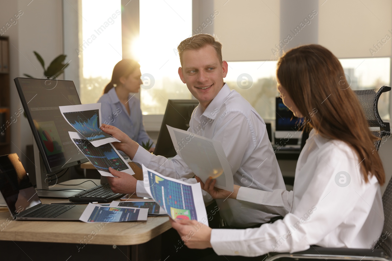 Photo of Stock exchange. Colleagues working together in office